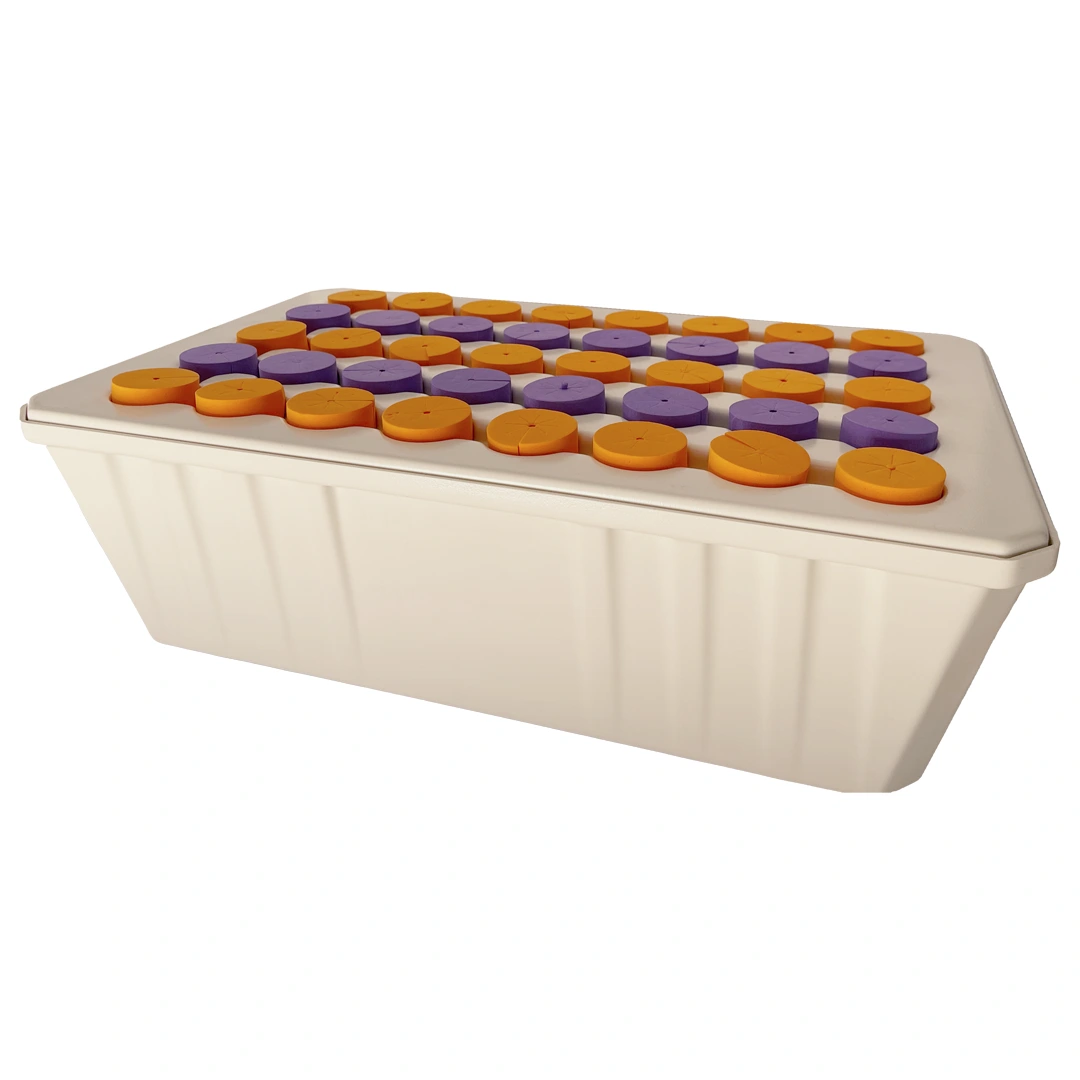 15307646121-aeroclonador-sistema-de-clonagem-para-cannabis-1-2.webp O aero clonador tem a aparência de uma bandeja de plástico cheia de furos em cima. Dentro desses furos, existem círculos coloridos que servem para segurar as mudas de maconha no lugar correto.